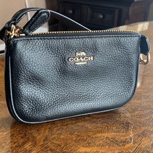 Coach Nolita 15 black mini pouch with strap. Perfect !